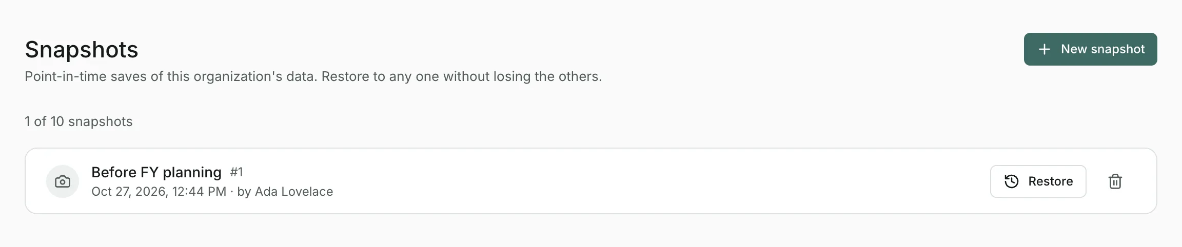 The Snapshots page with one snapshot, “Before FY planning”, showing who took it and when, with a Restore button.